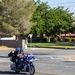 Marine and civilian personnel waved on veteran motorcycle riders with salutes and American flags along Route 66/Joseph L. Boll