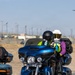 Marine and civilian personnel waved on veteran motorcycle riders with salutes and American flags along Route 66/Joseph L. Boll