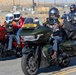 Marine and civilian personnel waved on veteran motorcycle riders with salutes and American flags along Route 66/Joseph L. Boll
