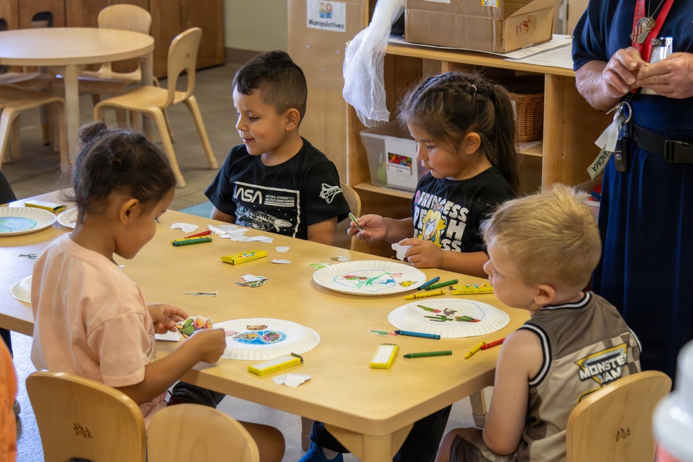 Children engage in arts and crafts activity during Earth Day event at MCLB Barstow's Child Development Center