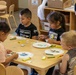 Children engage in arts and crafts activity during Earth Day event at MCLB Barstow's Child Development Center