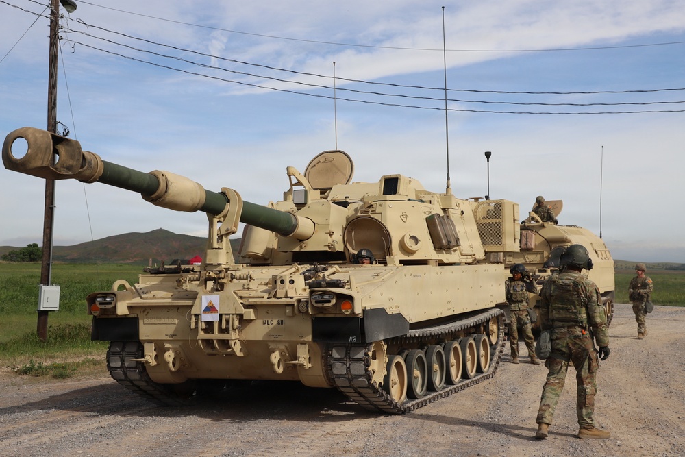 Best Redleg Competitors from 1st Armored Division Artillery load up ammunition in preparation for their evaluated live fire