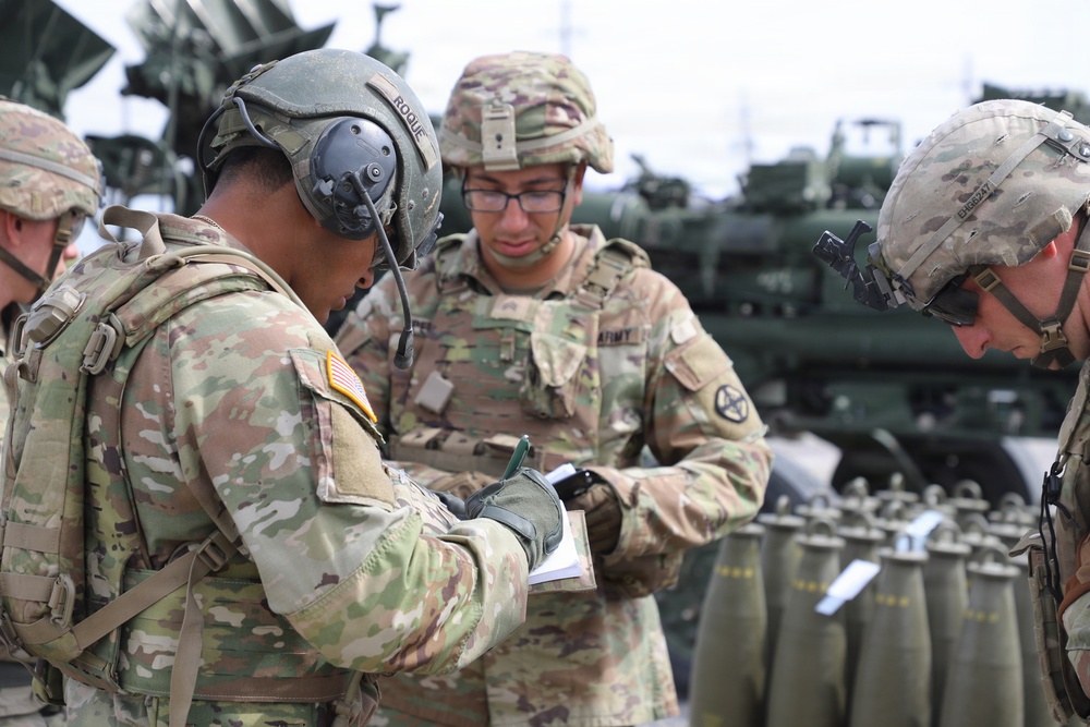 Best Redleg Competitors from 1st Armored Division Artillery load up ammunition in preparation for their evaluated live fire