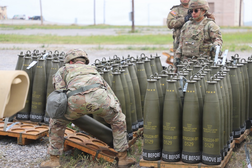 Best Redleg Competitors from 1st Armored Division Artillery load up ammunition in preparation for their evaluated live fire