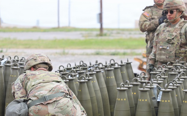 Best Redleg Competitors from 1st Armored Division Artillery load up ammunition in preparation for their evaluated live fire