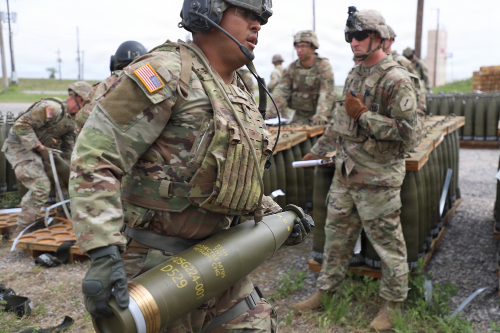 Best Redleg Competitors from 1st Armored Division Artillery load up ammunition in preparation for their evaluated live fire