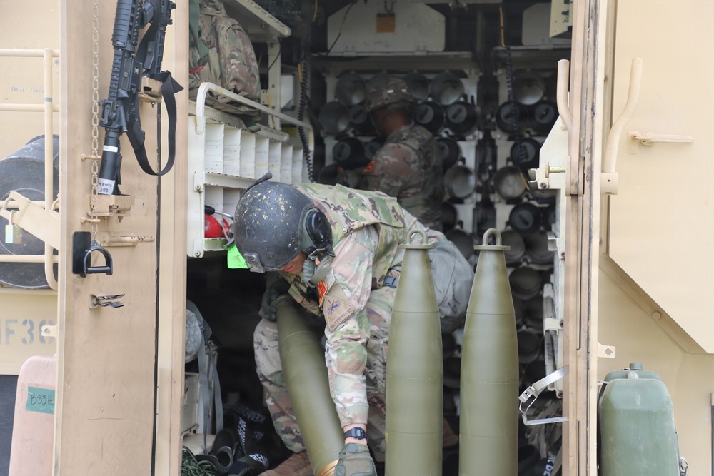 Best Redleg Competitors from 1st Armored Division Artillery load up ammunition in preparation for their evaluated live fire