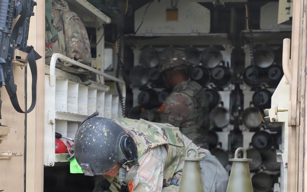 Best Redleg Competitors from 1st Armored Division Artillery load up ammunition in preparation for their evaluated live fire