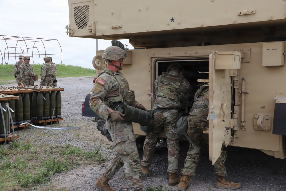 Best Redleg Competitors from 1st Armored Division Artillery load up ammunition in preparation for their evaluated live fire