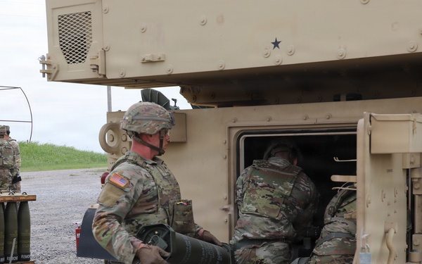 Best Redleg Competitors from 1st Armored Division Artillery load up ammunition in preparation for their evaluated live fire