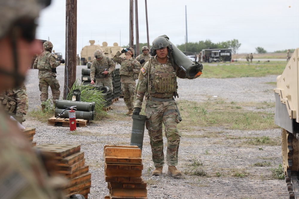 Best Redleg Competitors from 1st Armored Division Artillery load up ammunition in preparation for their evaluated live fire