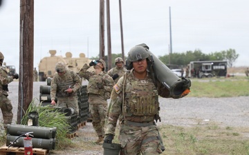 Best Redleg Competitors from 1st Armored Division Artillery load up ammunition in preparation for their evaluated live fire