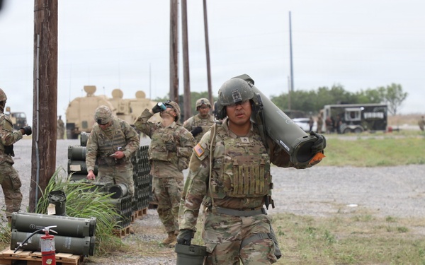 Best Redleg Competitors from 1st Armored Division Artillery load up ammunition in preparation for their evaluated live fire