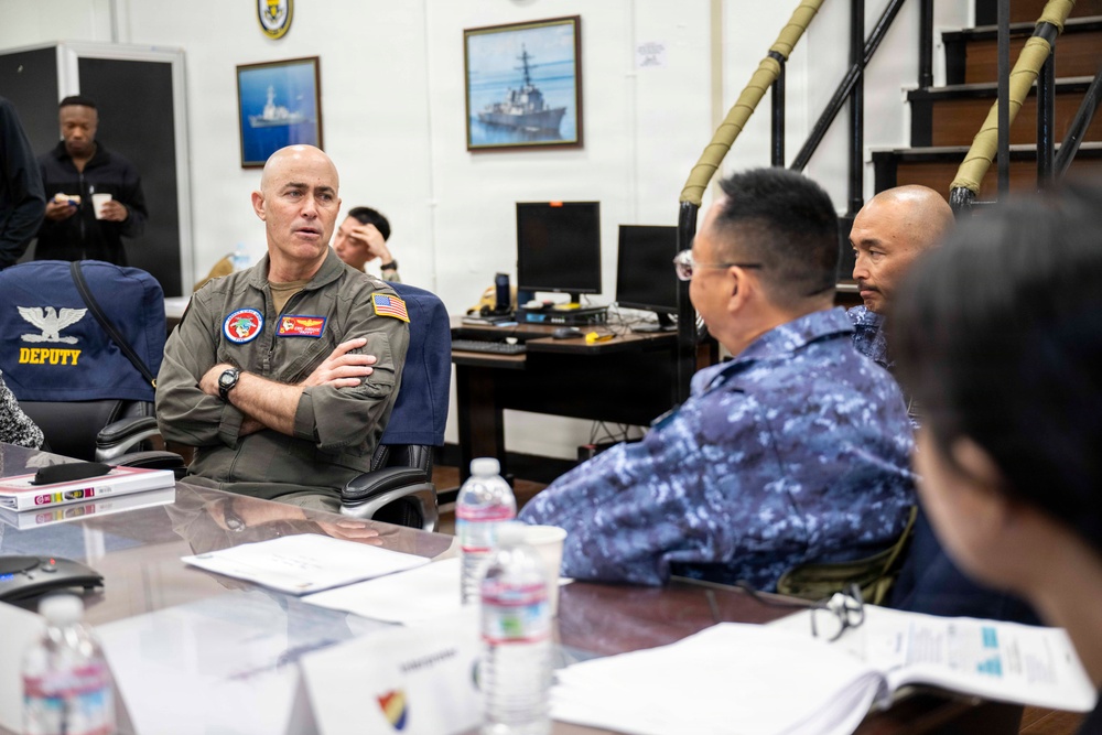 Rear Adm. Eric Anduze, CGS-5/CTF-70 Commander, meets with JMSDF Vice Adm. GOKA Yoshihiro and other JMSDF members during Flag Talks 26-2 at Commander Fleet Activities Yokosuka, Japan
