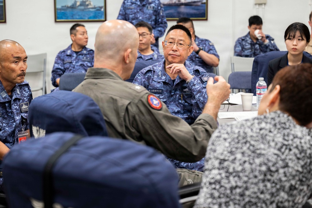 Rear Adm. Eric Anduze, CGS-5/CTF-70 Commander, meets with JMSDF Vice Adm. GOKA Yoshihiro and other JMSDF members during Flag Talks 26-2 at Commander Fleet Activities Yokosuka, Japan