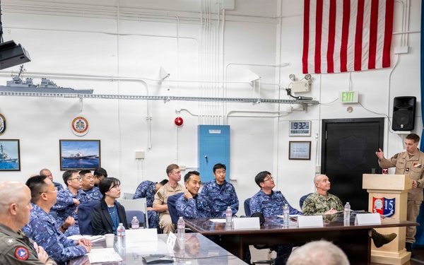 Rear Adm. Eric Anduze, CGS-5/CTF-70 Commander, meets with JMSDF Vice Adm. GOKA Yoshihiro and other JMSDF members during Flag Talks 26-2 at Commander Fleet Activities Yokosuka, Japan