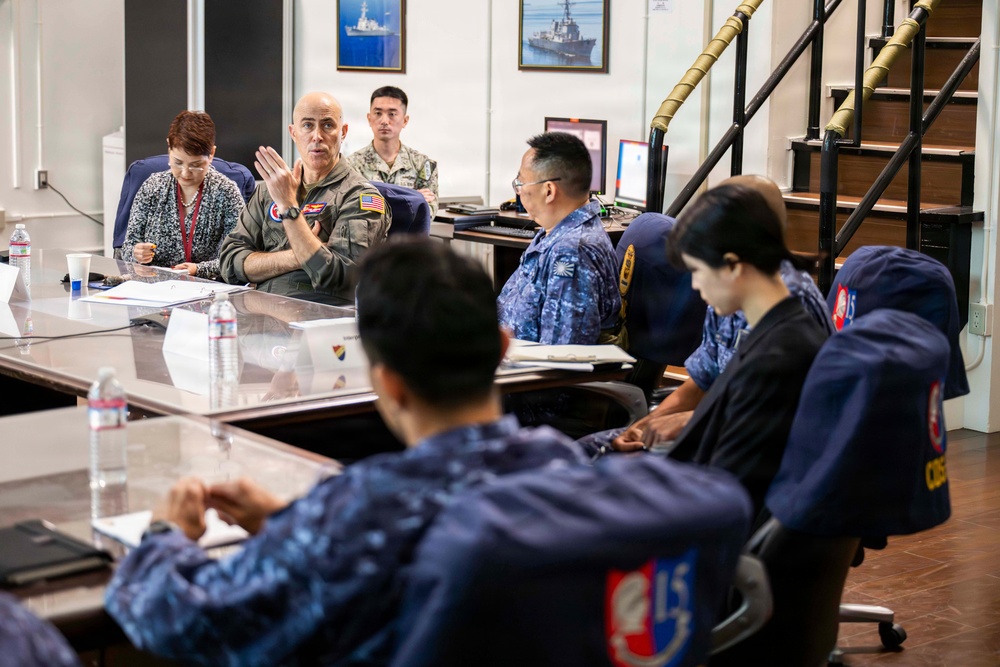 Rear Adm. Eric Anduze, CGS-5/CTF-70 Commander, meets with JMSDF Vice Adm. GOKA Yoshihiro and other JMSDF members during Flag Talks 26-2 at Commander Fleet Activities Yokosuka, Japan
