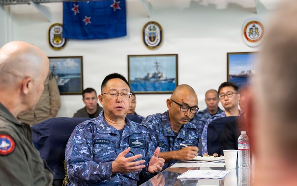 Rear Adm. Eric Anduze, CGS-5/CTF-70 Commander, meets with JMSDF Vice Adm. GOKA Yoshihiro and other JMSDF members during Flag Talks 26-2 at Commander Fleet Activities Yokosuka, Japan