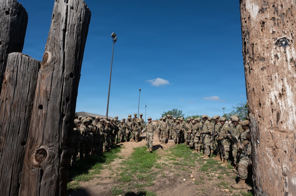 Defenders train over obstacles