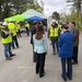 Officials and construction personnel gather at Topping Out Ceremony