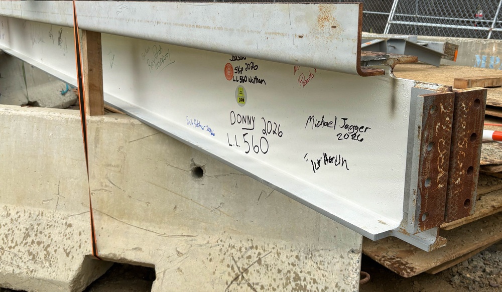 Signed steel beam at project milestone event