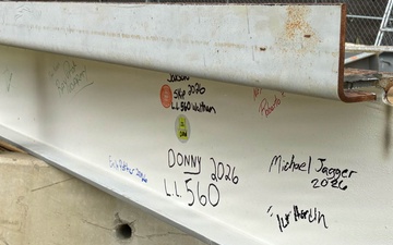 Signed steel beam at project milestone event