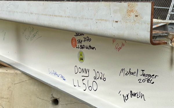 Signed steel beam at project milestone event