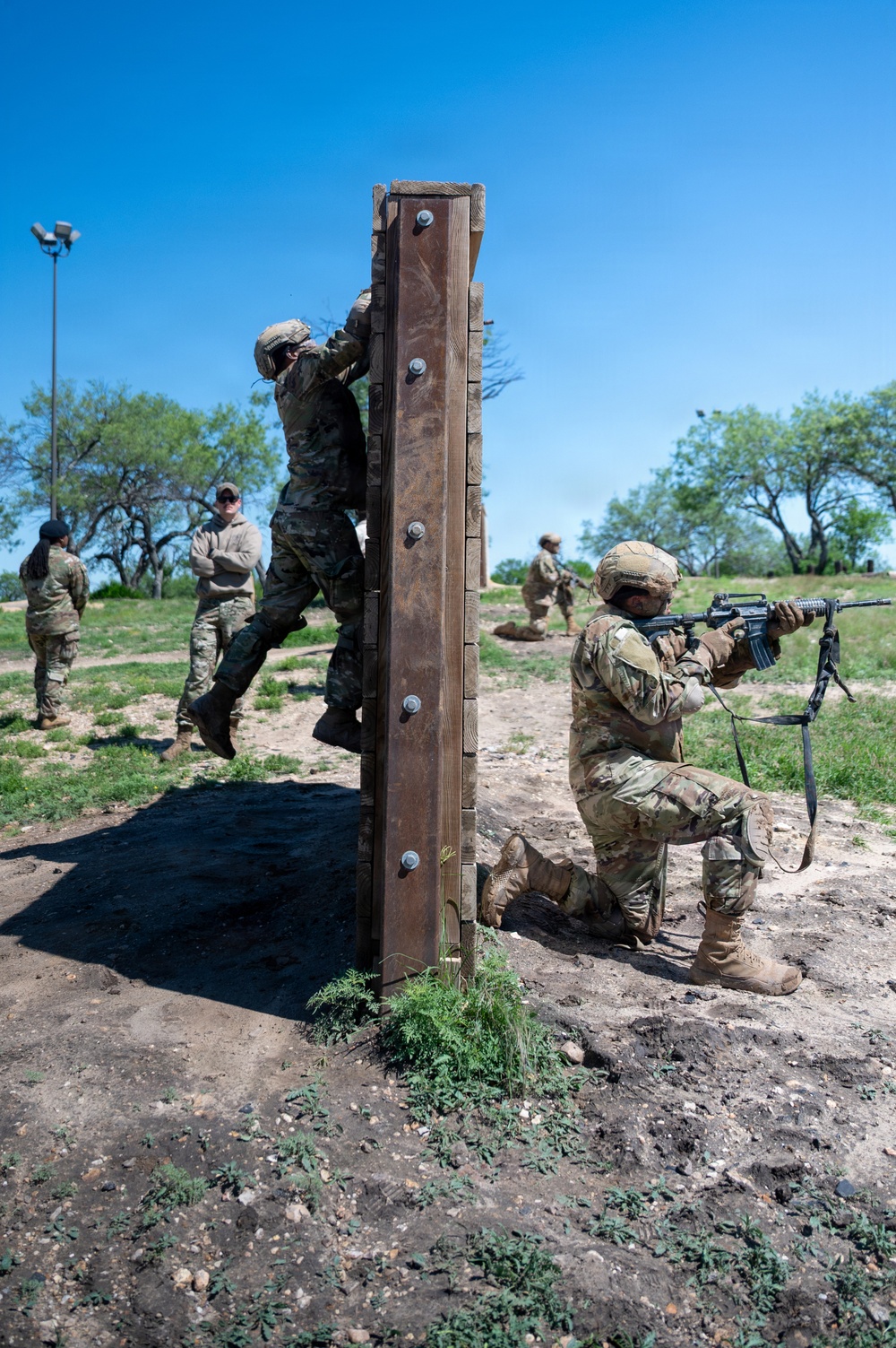 Defenders train over obstacles
