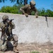 Defenders train over obstacles