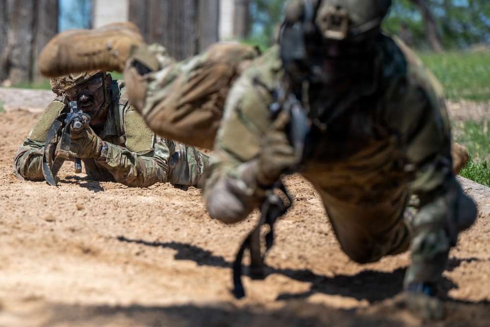 Defenders train over obstacles