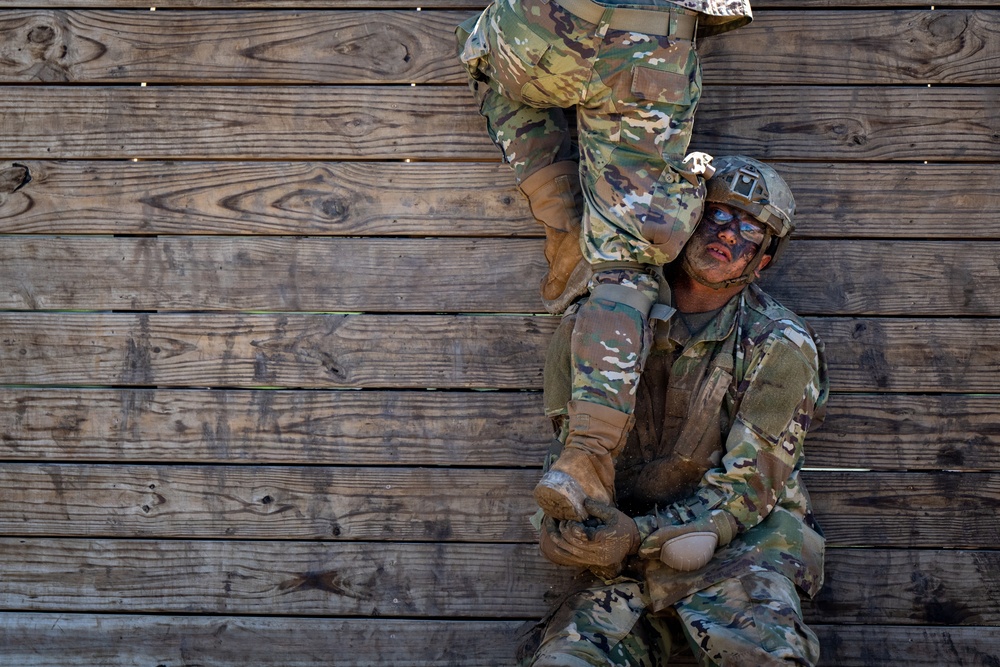 Defenders train over obstacles