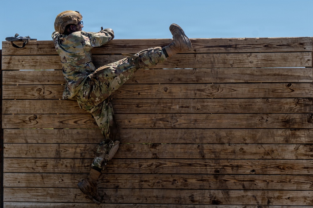 Defenders train over obstacles