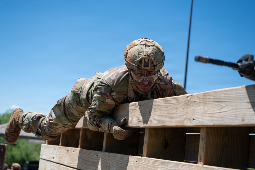 Defenders train over obstacles