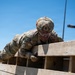 Defenders train over obstacles