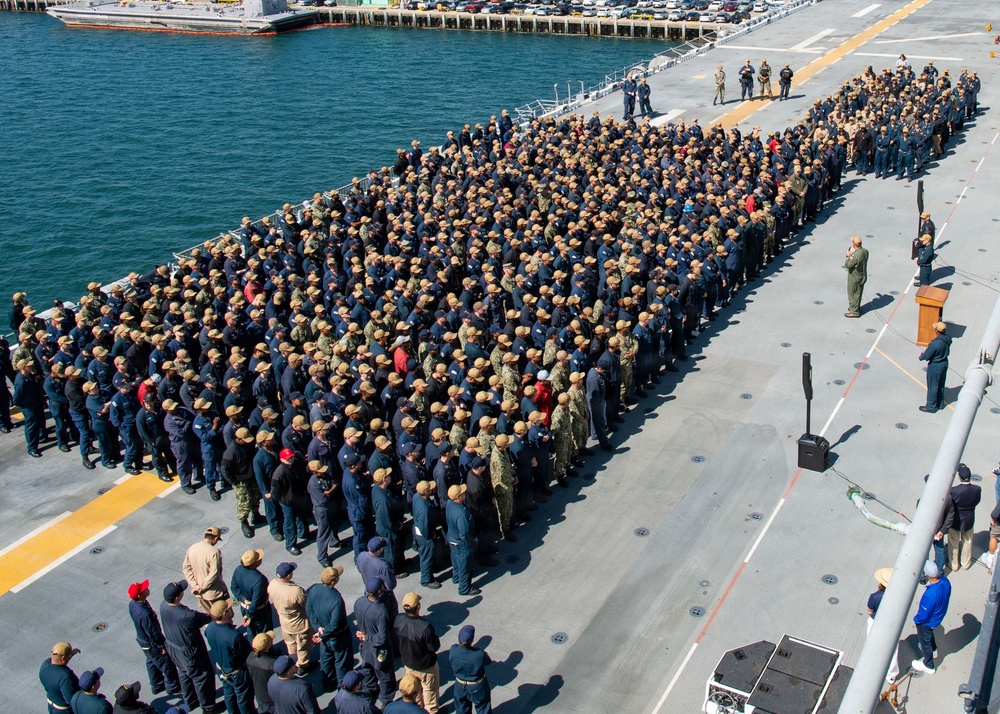 USS Essex conducts all an all hands call on the flight deck