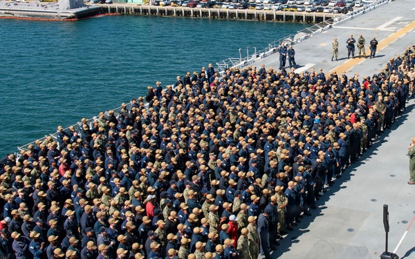 USS Essex conducts all an all hands call on the flight deck