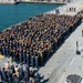 USS Essex conducts all an all hands call on the flight deck