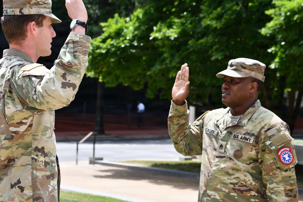 U.S. Army soldier re-enlists during outdoor ceremony