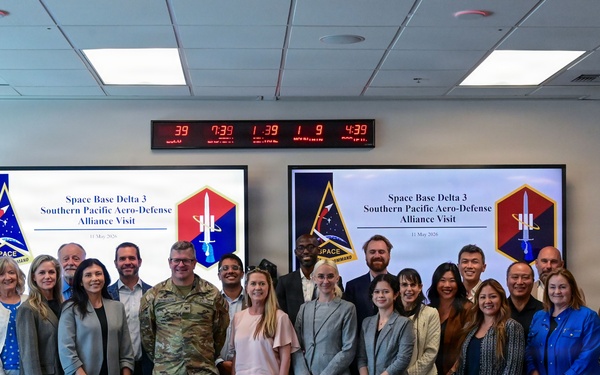 Space Base Delta 3 and regional civic and aerospace leaders pose for a group photo during a visit at Los Angeles Air Force Base