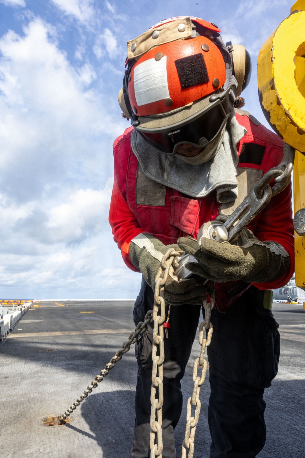 USS Iwo Jima Sailors Chain Down Equipment