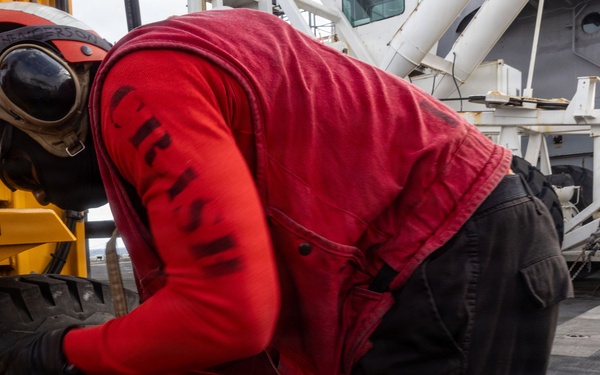 USS Iwo Jima Sailors Chain Down Equipment