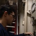 USS Iwo Jima Sailor Calibrates Equipment