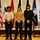 Marine Recruiter poses with his Poolees during signing day