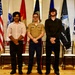 Marine Recruiter poses with his Poolees during signing day