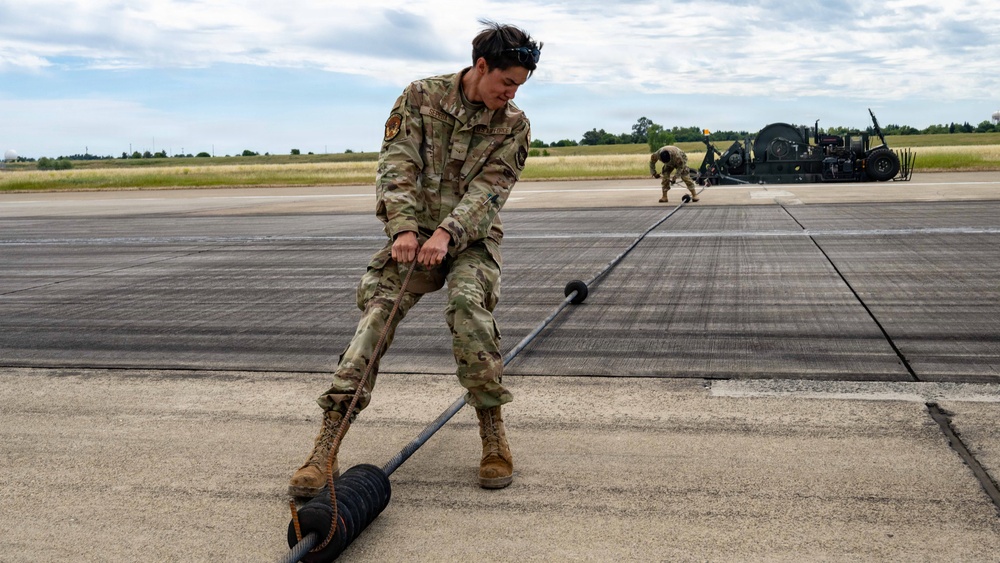 "Mission ready: 60th CES partners with Navy to test mobile aircraft arresting system”