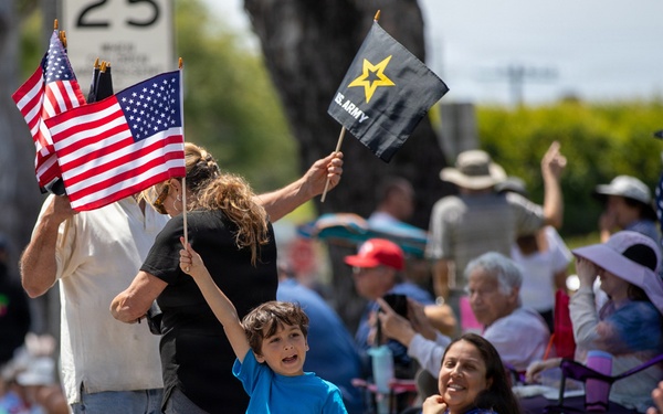 Child holds up American flag at TAFDA 2026