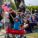 Child holds up American flag at TAFDA 2026
