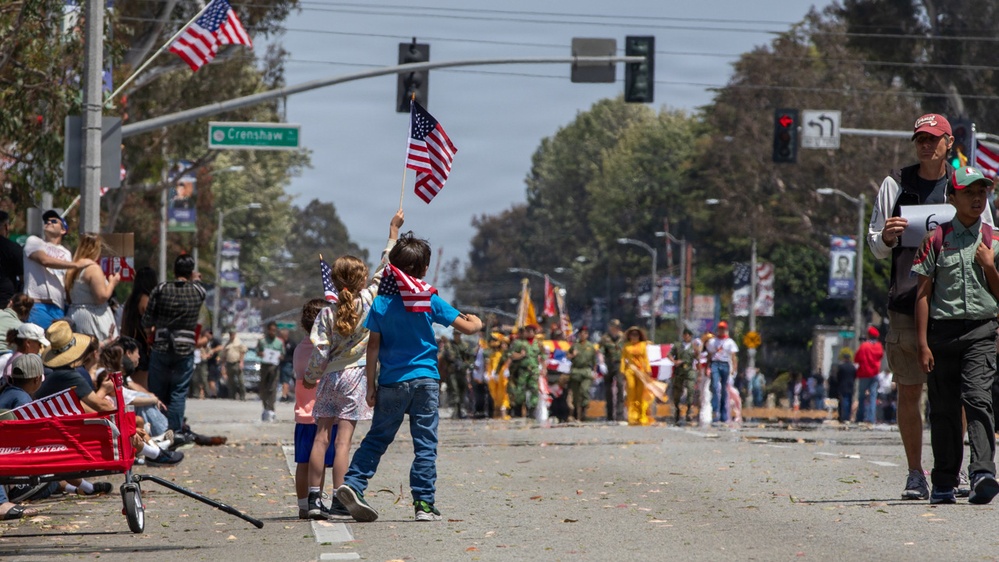 Children hold up American flags at TAFDA26
