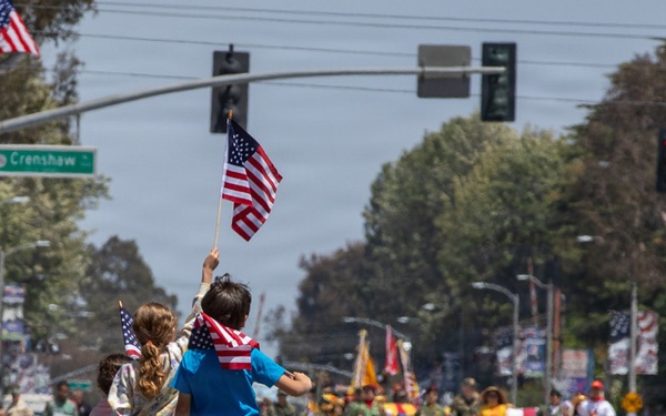 Children hold up American flags at TAFDA26