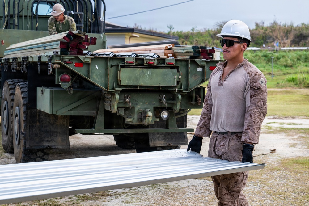 NMCB 1 Sailors and U.S. Marines conduct roof restoration operations in Tinian